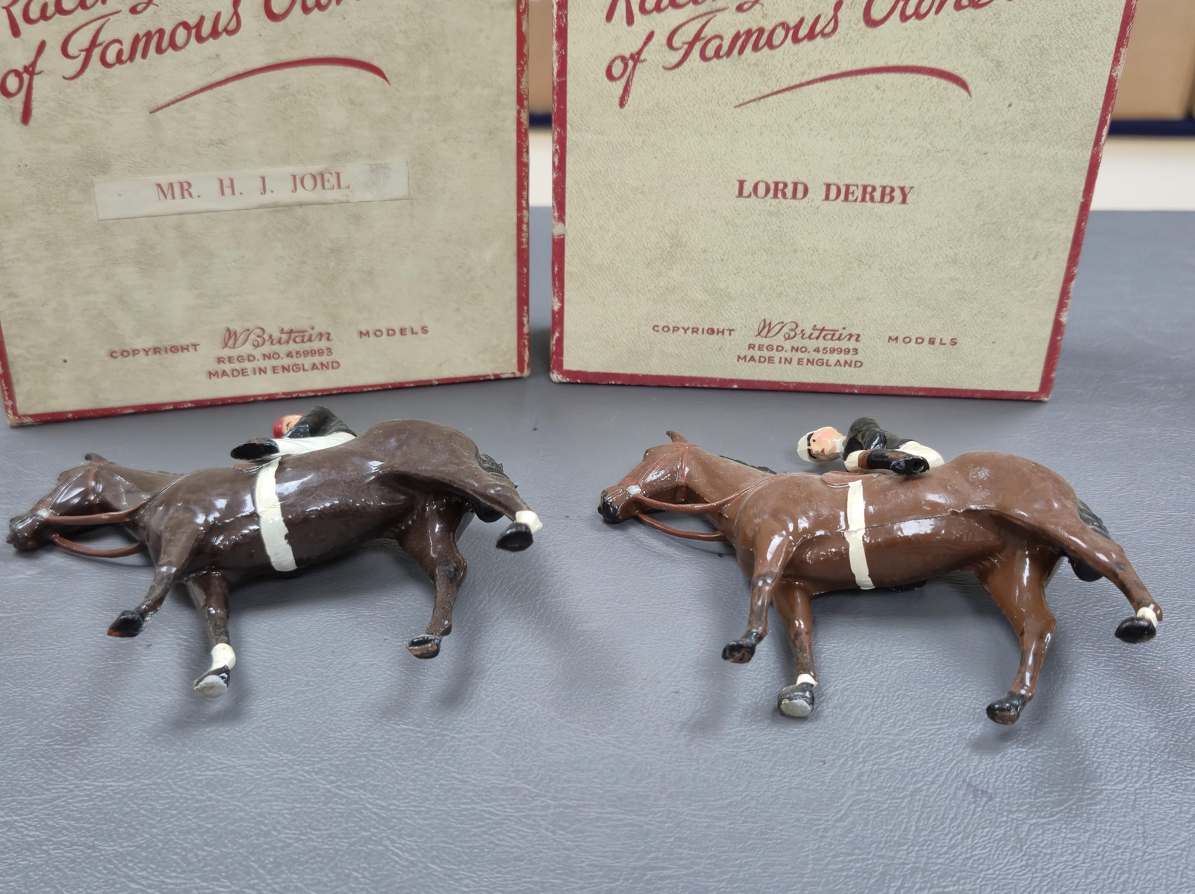 Two boxed Britains Racing Colours of Famous Owners series lead mounted figures; Lord Derby - rider in black jersey with a white cap on a brown horse, and Mr. H. J. Joel - rider in black jersey with red cap on a dark brow